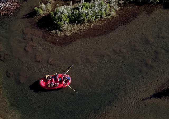 A raft on the river seen from above.