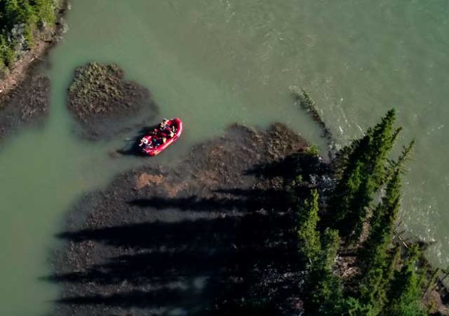 A red raf ton the river seen from above.