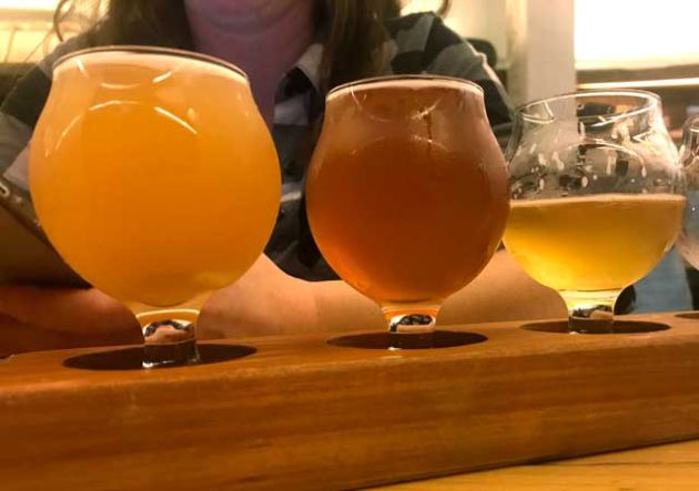 The samples of beer in a flight.