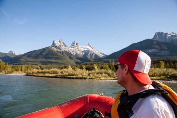 Sitting in a raft looking at the Three Sisters in Canmore