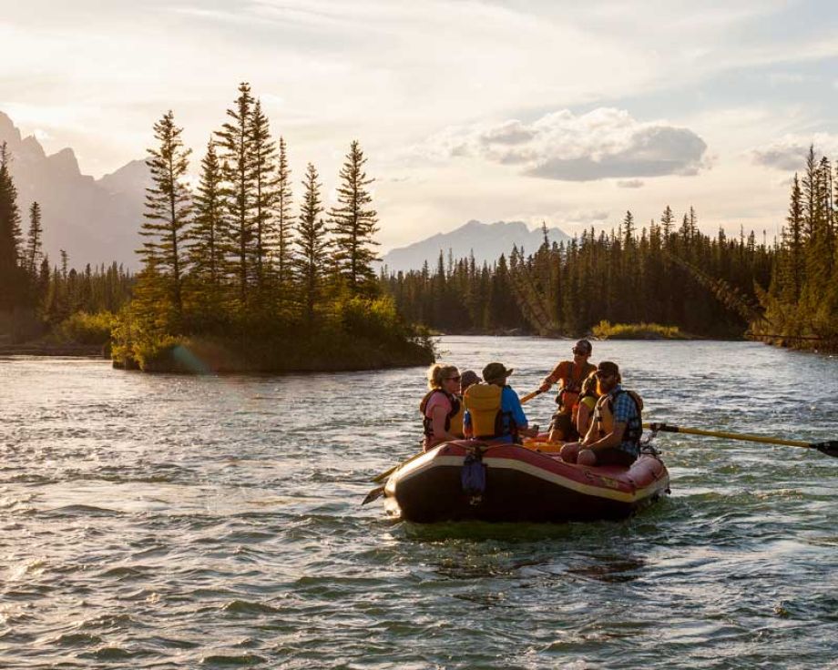 A raft on teh bow river in the evening.