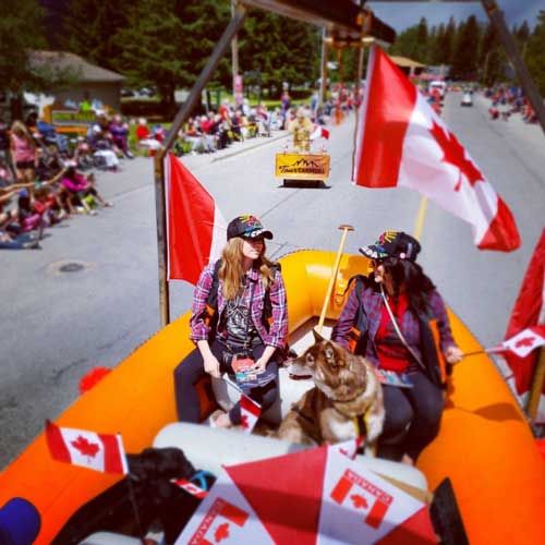 People in a raft in a Canada Day Parade