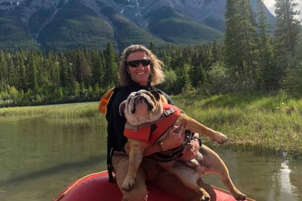 Raft guide and his dog on a raft